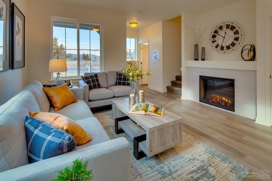 This Parkside (Right - Reverse) plan is full of many quality finishes such as quartz counters through out, stainless steel appliances, A/C pre-wired, 2 car insulated garage, electric fireplace with blower, and a Loft upstairs for additional living space.This home is an end unit with sliding glass door leading to fenced side yard. Residents enjoy the proximity to shopping on the east side of town and access to Highway 20. Nearby schools, parks, restaurants and medical facilities are just minutes away. Purcell Landing is the perfect neighborhood for those who want to lower their carbon footprint and have ample outdoor time in beautiful Central Oregon.*Virtual Tour is an example of layout and floor plan, not of actual home. Located on the Northeast side of Bend behind St. Charles Medical Center. Take 27th St. to Courtney. Come see why Pahlisch has won 150+ Quality & Value Awards! Photos of similar home, specs vary. Model located at 2582 NE Purcell Blvd. Bend OR 97701.