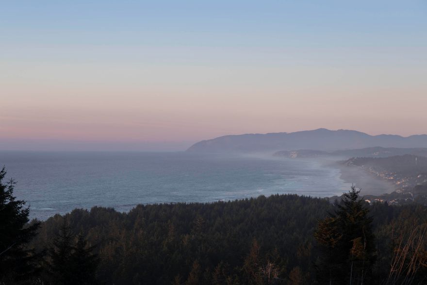 Commanding the most prestigious position in all of Depoe Hills' first phase, Lot 24 offers an extraordinary opportunity to build in a location where the views are as dramatic as they are enduring. Perched at the northern edge of the neighborhood, this homesite captures a cinematic panorama of the Pacific, with waves crashing endlessly along the coastline. Adjacent to the community plaza, your doorstep becomes an extension for outdoor living, ideal for impromptu gatherings, morning coffees, or sunset toasts. Floor plans are available for both a 3-bedroom or expansive 5-bedroom design, and with short-term rental eligibility already secured, the property presents both lifestyle appeal and income potential. Here, the rhythm of coastal living is ever present in one of the Oregon Coast's most inspired new enclaves.