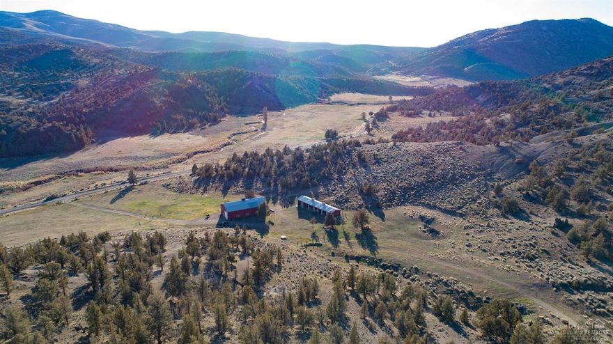 1208 acre Ranch/Recreation property with 3200 sq ft barn that has living quarters with one bed, one full bath, full kitchen and open living room in the loft area with one bed, one bath below the loft. 7 bay 2400 sq ft machine shed. Three springs with one spring plumb to the living domestic water. This property is truly unique and has amazing views, property borders Prineville Reservoir State Park and BLM.