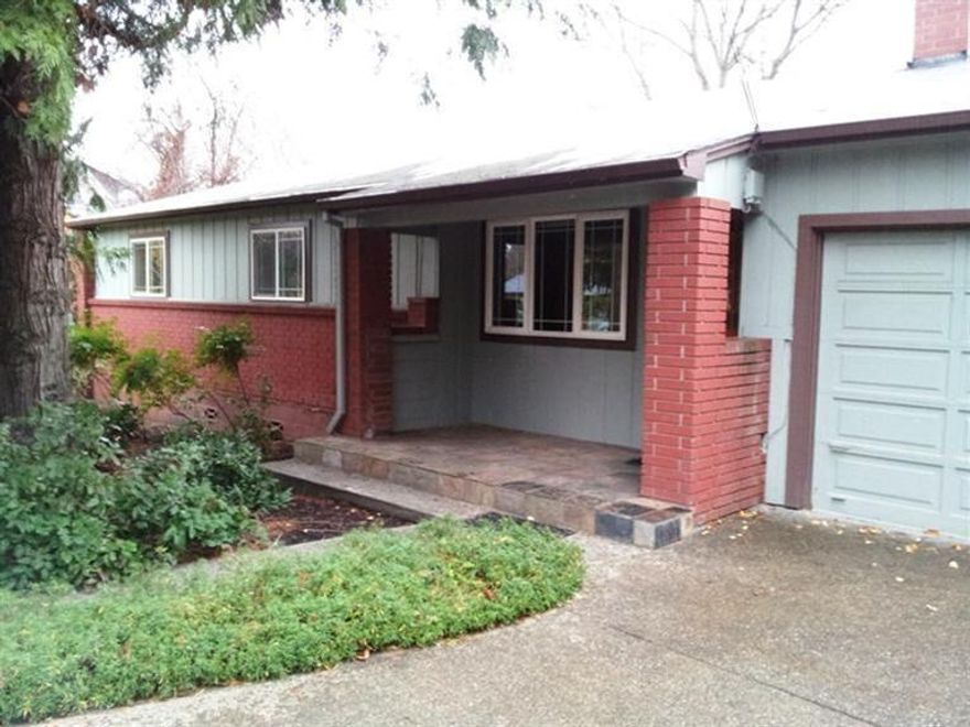 Fetching Prairie-style mid-century home located above the boulevard but not up the hill. Updated with hardwood floors, cherry and maple cabinetry, granite and limestone counter tops, double-paned windows and more. Gas fireplace, new carpeting, newly refinished wood floors, and new electric panel. Furnace serviced, ducts cleaned. Really nice lot with mature landscaping and fruit trees. Quite a find.