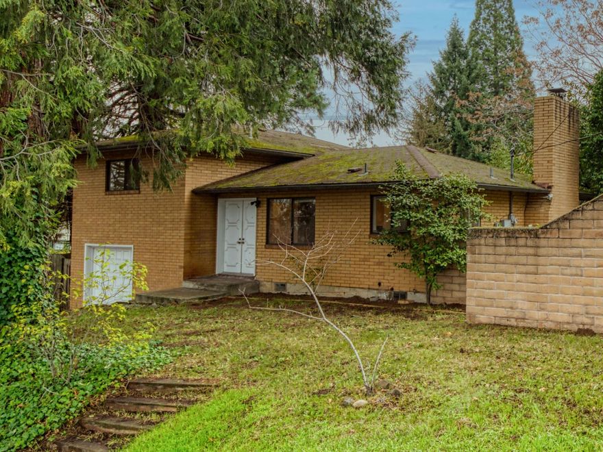 Open House this Saturday (12/4) from 11:00-2:00! A rare all brick home, this 2-Bedroom/2-Bathroom split level rests in the Lone Pine School District. Inside find a nicely appointed kitchen featuring granite countertops, under mount sink and stainless steel appliances. The  living room includes hardwood floors and a fireplace nicely complemented by the floor-to-ceiling brick hearth. Both bedrooms include a generous amount of closet space and the main bath is adorned with a tiled shower. The 500+ SqFt garage is heated, includes the 2nd Bathroom, laundry area and has ample room for a workshop. Outside the fenced side yard is surrounded by large evergreens features a small garden shed. Mere blocks from the country club and surrounded by larger homes, don't miss this East Medford gem.