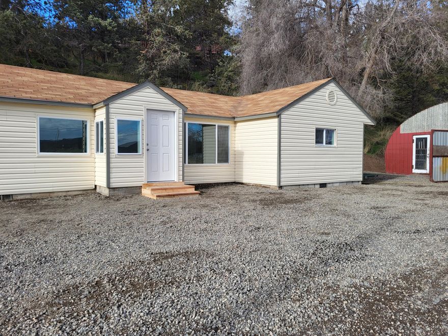 Beautifully remodeled two-bedroom, one-bath home on a spacious one-acre lot! This charming property features fresh exterior paint giving it great curb appeal. Inside you will find a modern and stylish renovation with updated finishes throughout. A large shop provides ample storage or workspace, while a bonus room offers endless possibilities - home office, guest space, or hobby room. Enjoy the privacy and tranquility of country living while still being close to town . A must-see home with plenty of space to make it your own!