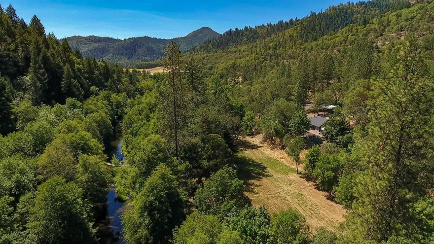 25.12 Acres, WR Zoning with the glorious E. Evans Creek running through it! 1.9 acres of water rights! About 4 acres of picturesque meadow land running along a particularly wide and beautiful part of the creek banks. This is a must see. Views of the creek, meadow and trees! It is hard to find something this amazing in this price range!!!! Swim next to your own waterfall! Or pan for Gold! Some of the features include: a circular drive way with 2 gates the 2nd one for large vehicles. 3rd separate entrance to the acreage. Logging and/or growing on your own property. Tons of parking! The cozy, completely furnished home features a beautiful wood burning stove, custom back splash, claw foot tub, knotty pine, outdoor shower, gazebo, large fenced dog run, storage shed, backing to BLM with lots of privacy. Partial remodel in 2007. All information must be verified by buyer. Buyer to do their own due diligence in regards to all uses of subject property.