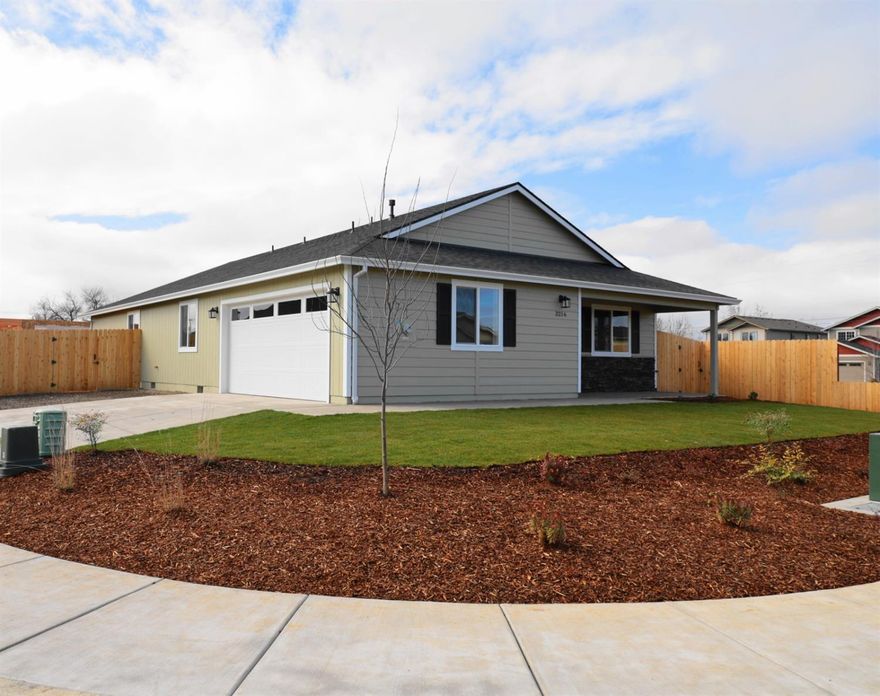 Brand new Quality Construction !! Awesome opportunity to own a newly constructed home that is 1612 Sq Ft with 3 beds 2 full baths with a great design open concept.! High caliber construction. Appliance package including custom cabinets, dishwasher, microwave, and a gas stove/oven combo! Living space includes hardwood flooring, with a nice heating and air system for maximum efficiency! Double insulation in the walls block out noise and keeps the home super cozy. Nice master bedroom has vaulted ceiling with fan and a walk-in closet! This home comes with an attached 2 car finished garage on a large corner lot. Affordable in an up and coming neighborhood surrounded by newer homes with a builders warranty!