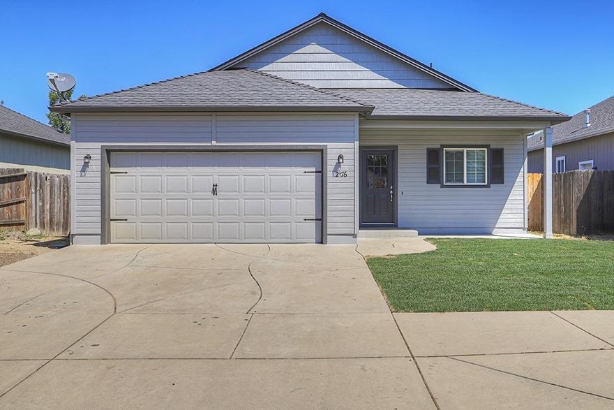Lovely Redwood neighborhood of like-homes on a quiet street is just the spot for this 1502 sq/ft three bedroom/two bath home built in 2005. Original owner has spruced it up with new interior paint and new flooring that sets off the vaulted ceilings (9' throughout). Lots of niceties including gas heat, a covered patio and finished garage. New in-ground sprinkler system is taking care of the newly laid sod in the front yard and freshly seeded backyard. Ready for you to move into.