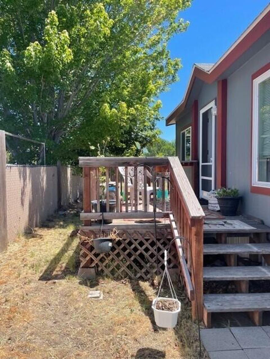 Great opportunity on this 3 bedroom, 2 bath home in Shasta Glen Manufactured Park. Current owner has put in some added windows for more natural light, Newer Laminate flooring in living spaces,  and carpet in bedrooms.  Owner recently painted the exterior of the home as well.  Home has fenced yard, a shed for storage, deck and car port.  Inside the kitchen you'll love all the storage it provides and how it opens up to the living space with a bar for additional seating.  Primary bedroom has nice sized closet, lots of natural light, soaking tub with shower.  This property has nice storage throughout and will be ready for new owners to close in July.  Buyers to be pre-approved with park manager prior to submitting offer.