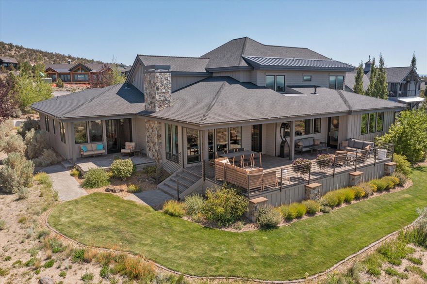 Stunning NW Style home featuring some of the best views that Brasada Ranch has to offer. Perfectly positioned along Hole #13 of Brasada Canyons this 5 bedroom/4.5 bath home offers bright, contemporary, clean lines throughout the interior and features a 2 bedroom/2 bath casita for family and guests. To the east is a very private courtyard and garden complete with a patio and gas firepit for morning coffee or libations later in the day. To the west is a large patio that offers nine peaks of unfettered Cascade Mountain views. These views are accentuated with the deep green contrast of the 13th Green and Fairway at Brasada Canyons. Inside you will find an open plan living space and a kitchen perfectly designed for entertaining. The primary bedroom is on the main floor with stunning views of the Three Sisters as you rise in the morning. This custom home features high end materials throughout and blends warmth with a contemporary vibe.