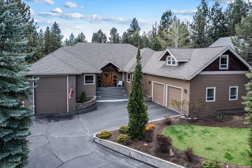 Incredible westside location at the top of River's Edge Village. This mostly single level home, with a huge & hard to find 42' RV garage, is beautifully set on the 5th tee and features a large open great room with fireplace, gourmet kitchen and a perfect indoor-outdoor flow. Living space is all on main level with excellent separation of primary and guest rooms. Owner's suite features two closets + an oversized bathroom and soaking tub. Two BIG guest bedrooms, guest bath and laundry round out main floor. Take a few steps up and find a gigantic bonus room that sits above the 2 car garage. The separate RV garage is amazing! At just over 42' with climate control + hook-ups and new flooring! It also leads to addl. 680 sq.ft. of finished flex space and basement storage. Close to river, trails, shopping, restaurants & golfing. Dual water heaters, recirculation pump, security system, water feature, double ovens, AC and more. Home has assumable VA loan under 3.0%!