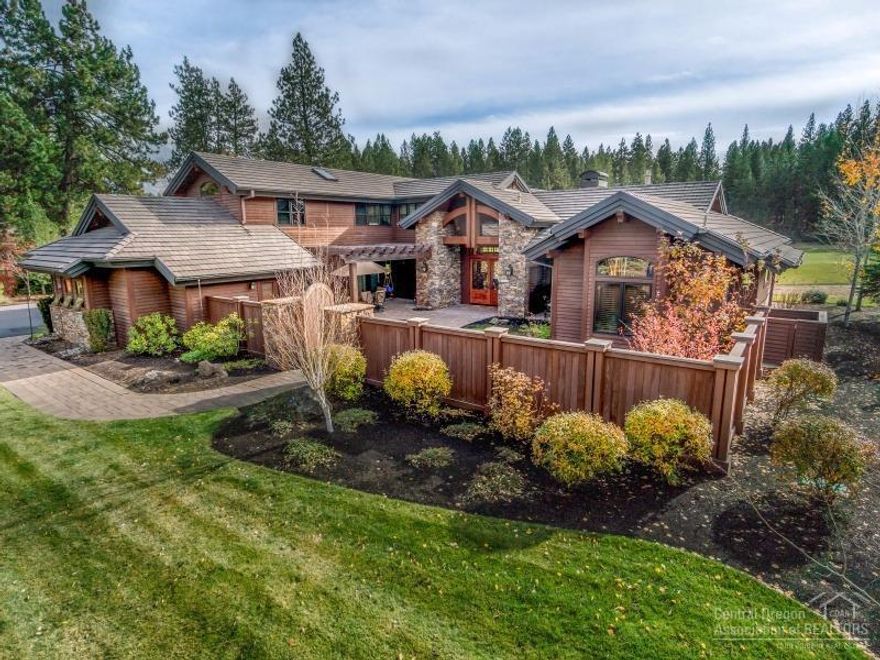 Exquisite Jim Norman Designed Home with Courtyard and Grand Entry. Beautiful Broken Top setting with views of the 15th fairway of the golf course. Home offers a main level master suite, hardwood floors throughout, large floor to ceiling stone fireplace, family & media room, office, and custom built-ins throughout. Gourmet kitchen has 2 ovens, large island, commercial ranch, and slab granite counters.