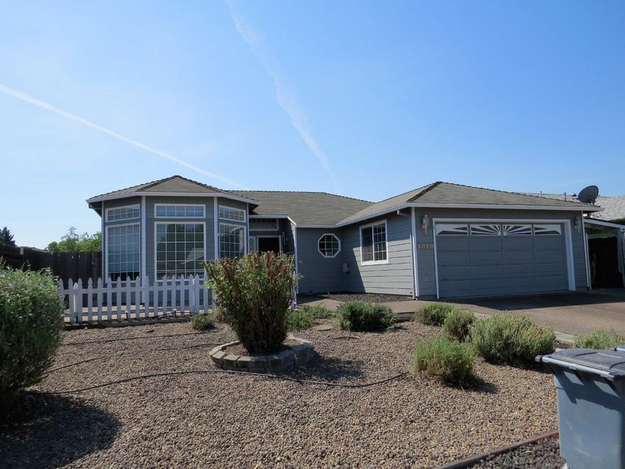 Wow! This home is clean and ready for you to move in. Two car garage, covered area along side of the home for whatever you need. Located in a great Central Point subdivision with a design that gives great curb appeal! The living room has a beautiful brick gas fireplace and practically floor to ceiling windows for ample natural light. Welcoming dining area with large bay window and view to the back yard. Covered patio to increase your outdoor living in this spacious yard with sprinkler system. Newer furnace, seller is in the process of getting a new roof and will give a $2000 carpet allowance.