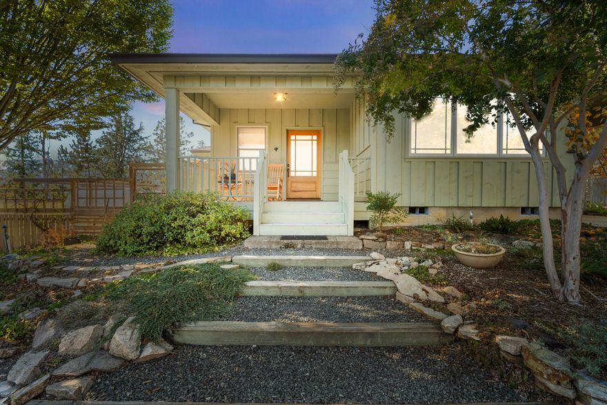 The ultimate close-in hobby farm for nature lovers and 4-H. Enjoy sunrises and sunsets, mountain views and warming winter sun from your own idyllic hideaway. Gardeners will love the stunning landscape designed for every season. TID irrigation supports mature fruit and nut trees and raised garden beds. 2 primary bedrooms plus a den that could be a third, and an office. Finely crafted with passive solar in mind, this quality-built home has many extras: clear-fir doors and trim, 9-ft ceilings with architectural elements such as a barrel vault and coved ceilings with high-end textured finishes. A counter-flow masonry wood heater provides radiant heat. Ample natural light with Velux operable skylights and Anderson wood windows. Well-maintained with new roof, exterior finish, irrigation pump all in 2024. Has a 24' by 40' finished SHOP with 12' ceilings and south-facing windows with winter-time views of Mt. Ashland. A quality home on small acreage in a prime location is rare.