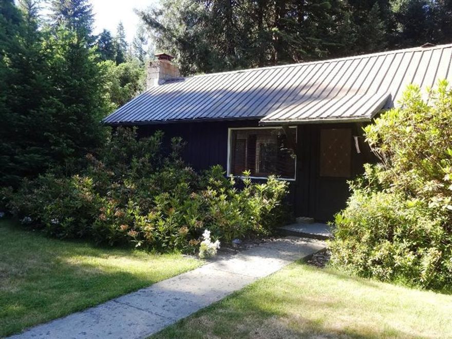 Setting in a secluded wooded forest in the charming community of Prospect. This home is close to downtown Prospect, schools, shopping and restaurants. This is a quaint 2 bedroom home. The large master bedroom has an abundance of closet space. The owners added on a second bedroom and extended the family room to add a lava rock fireplace. The bright kitchen has amazing views of the spacious backyard. The front and backyard are fully landscaped and fenced. In the spring there are amazing rhododendron bushes that are the envy of many neighbors. The back 1.5 acres are in a beautifully wooded setting that has a nice aroma due to the mature pine trees.