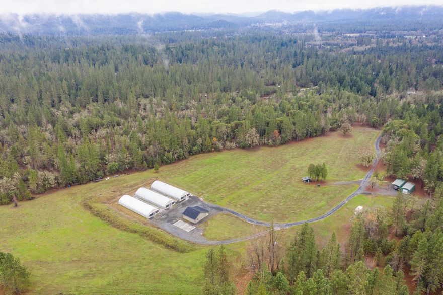 Bring your OLCC Producer License!  Privacy and peace behind two security gates down a secluded road with 40.63 acres of EFU land and Homesite Approval. Three 30' X 96' greenhouses with propane heat used for all year growing.  These highly efficient greenhouses feature power operated interior light dep curtains, concrete perimeter foundation, water tanks, and 1000 watt grow lights.  The property includes a 32 X 32 insulated dry building, large covered RV space with 35' camper with water and septic.  The 9'6'' high cube shipping container for storage as well as the additional green dry building located by the camper are included.  Water rights will be approved on or about 01/14/2022 for 35 acres.  Documentation is available regarding the approval.  Bring your plans and builder to start your custom dream home with panoramic views!  Rocked roads ready.  Owner financing  is available!