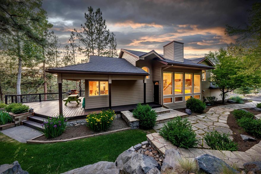 Tucked just outside city limits on a beautifully wooded 1.16-acre lot, this updated home offers the perfect mix of privacy and natural surroundings. Inside, enjoy fresh paint, new carpet, updated bathrooms, and expansive windows that fill the space with light and frame peaceful forest views. A striking cedar-lined entryway with floor-to-ceiling glass welcomes you into the heart of the home. The flexible layout features great separation between the primary suite & office/4th bedroom and the two other bedrooms and bonus area with pool table (included) that opens to a large deck with hot tub—perfect for entertaining. Outside, relax by the built-in fire pit or explore Deschutes River Trail with access at the end of Brogan. Added comforts include radiant floor heat, a heat recovery ventilation system, whole-home humidifier, and neighborhood perks like private river access, lower taxes, and Firewise community designation.