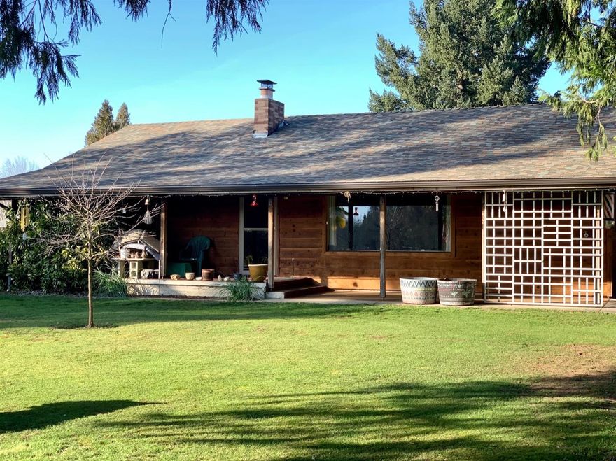 Hard to find low bank riverfront property! This home features 2 bedrooms, 1 and a half bathrooms, a large detached 3 car garage and a beautiful view of the Rogue River. With a .45 acre lot and the convenience of being close to downtown, this property is a must-see!