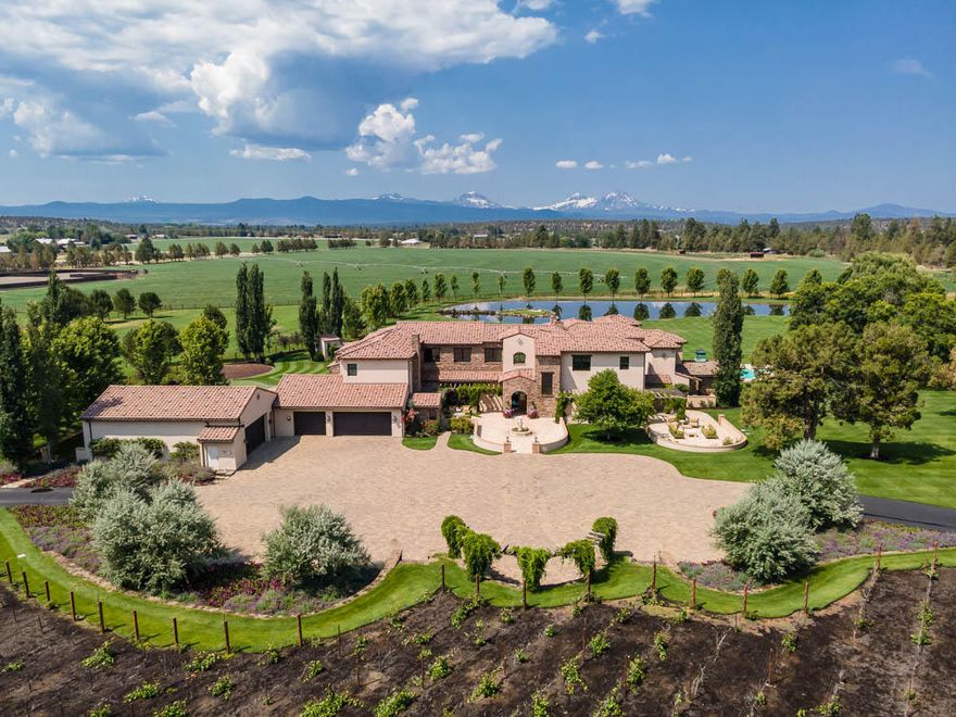 Experience an Extraordinary Life. Oregon green splendor blends with equestrian excitement on this 123 acre private ranch in the heart of Central Oregon minutes from Bend. Surrounded by the Cascade Range, the mountain views are breath taking & with Central Oregon's incredible 4 season climate, life here is simply intoxicating; Hot Summer days, Cool Fall nights, Snow covered Winters, Warm Spring freshness. Indeed a labor of love, the Cline Falls Road Ranch was created with passion. Step into this equestrian lifestyle at a level that Oregon has not seen. Alongside the 65,000SF heated indoor arena & the outdoor arena, ideal for english/western riding, you can work on your short game, refine your tennis, yoga on your paddle board, cast, catch & release, back stroke beneath the majestic Three Sisters, garden, collect eggs, farm hay, harvest your grapes, tend to your fruit orchard,or relax & retreat into your exquisite home. Ah and so much more...A unique opportunity for the discerning buyer.