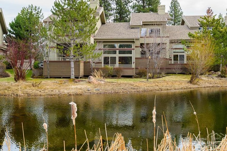 Lake front end unit townhome in the heart of Broken Top. Open floor plan with an inviting sunken living room with gas fireplace. Expansive windows bring in the natural light and views of the lake. Master suite on the main with private deck access. Upstairs is a second master and additional room / den with built in Alderwood murphy bed and cabinetry. 3rd full bath and loft area overlooking the great room complete the upstairs. Attached two car garage, central A/C and fully landscaped.