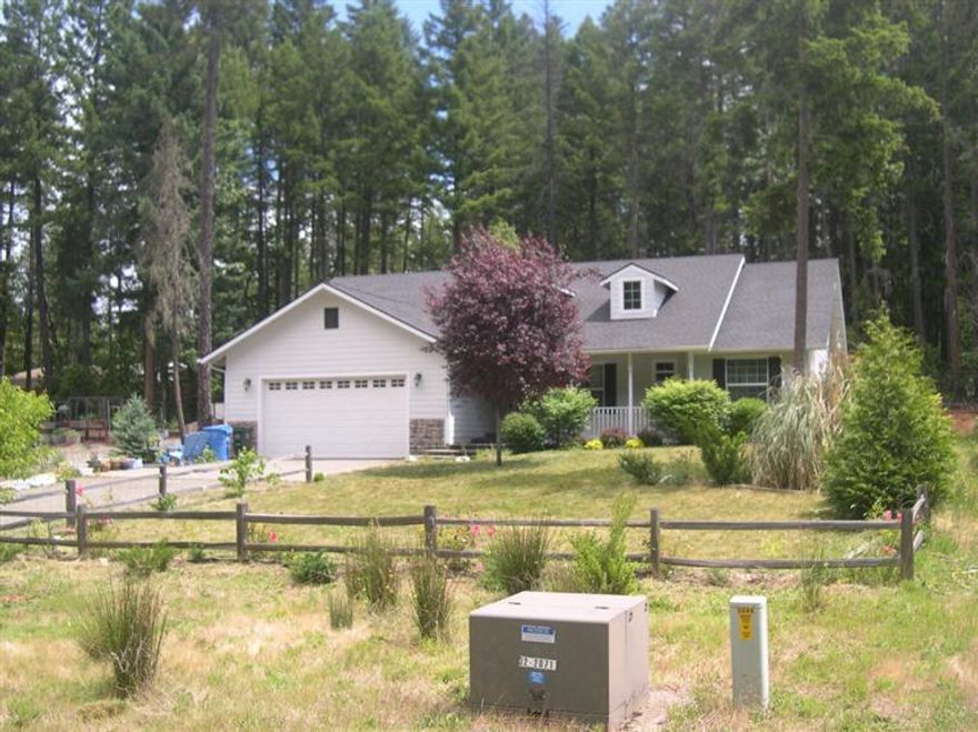 Newer home on the outskirts of town with over a quarter acre. 3 bedrooms , 2 baths. 1687 sq. ft. Several upgrades such as vaulted ceilings, tile, granite counters and propane fireplace. Walk in closet in master bedroom and master bath. Garage is finished off inside and even has hot and cold water in the utility sink. Hardiplank on exterior of home.