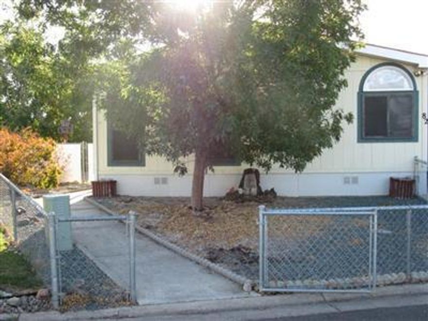 This huge family home sits on a large fenced lot in Butte Crest Family Park. This house has 1782 sq.ft. split floor plan and vaulted ceilings. Kitchen has an island, lots of storage and kitchen nook. Large formal dining area and laundry room with utility sink and storage which also has a back door that goes out to the very large deck and back yard. Carport is somewhat enclosed and has two storage sheds at the back. Home will have new carpet and paint through-out plus more. Check it out and bring offer.