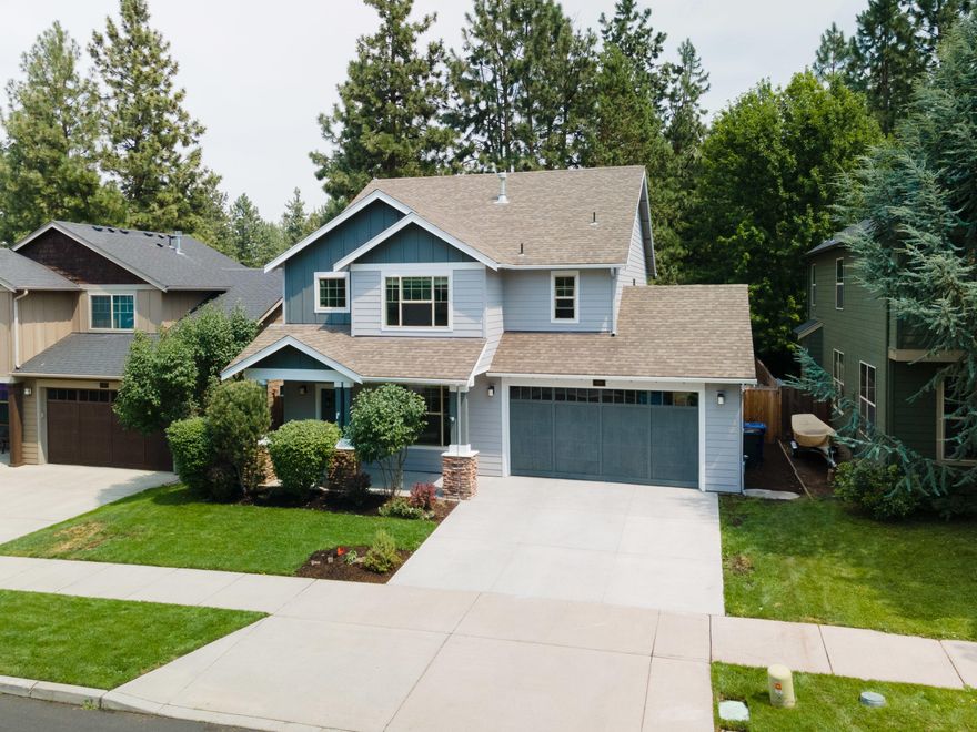 Completely retouched 4-bedroom home w/AC in SW Bend featuring a great room layout about a block away from Pine Ridge Elementary, Pine Ridge Park, The Pit & Deschutes River Trail access. The home was just repainted inside & out & has brand new carpeting along w/a recently serviced HVAC system. The hardwood flooring & tile on the main floor are in good condition & the main floor only has carpeting in the downstairs bedroom/den. The kitchen has stainless appliances, a spacious breakfast bar & dining area, & the living room w/gas fireplace is spacious enough to comfortably seat nine people or more. Upstairs you'll find a large primary suite w/soaker tub, shower, & a spacious closet. You'll find high quality window treatments throughout as well. The back yard is newly landscaped & has great shade and privacy. The side area of the back yard behind the garage is graveled for easy upkeep & offers great storage w/ample room for a 200sf workshop or storage shed if needed.