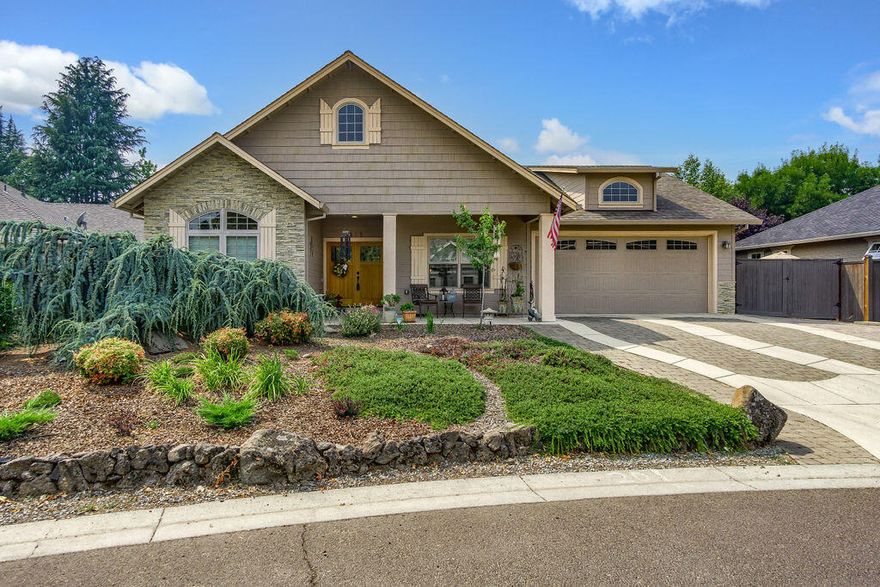 Highly desirable Vineyard View subdivision in Jacksonville.  Single level open floor plan w/vaulted ceilings in great rm, master & 2nd bdrm.  Dbl doors off covered front porch. French doors into 3rd bdrm/library/office. Many Harwood & tile floors. Gas log fireplace w/ stack stone & wood mantel. Skylight in great rm & master bthrm.  Lg open kitchen w/ granite counters, lg island w/bar, 5 burner gas cook top w/gas oven, 2 fridges, beautiful hickory cabinets.  Good size master suite w/dbl sinks, granite counters, tile floors, lg tile shower, walk in closet & water closet.  Laundry rm w/granite counters, tile floors, deep sink & extra cabinets for storage. Guest bdrm on opposite side of home.  Gorgeous lg fenced backyard & mature private landscaping, garden bed. 2nd paver patio, storage shed & RV parking. Home overlooks green belt neighborhood park w/paver walkways, lawn area & open beam vaulted gazebo.