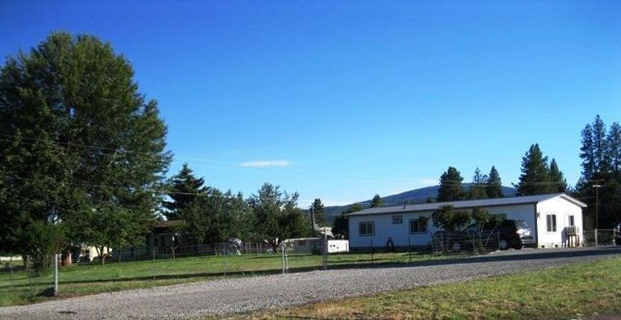 Keno- 1.32 Acres-Updated, cute & clean 3 bedroom 2 bath Double wide MF has copper wiring, all new plumbing, updated bathrooms, new roofing, new siding, new vinyl windows, new septic 2010,fresh interior paint, full foundation underneath, 3 outbuildings, pellet stove & electric heat. Large fenced backyard. Front yard is almost fenced all the way. Wide well graveled driveway. Go out back gate and walk up road to go fish or play at the river! Kitchen appliances stay. Washer & Dryer negotiable. Cash or owner carry with large down.