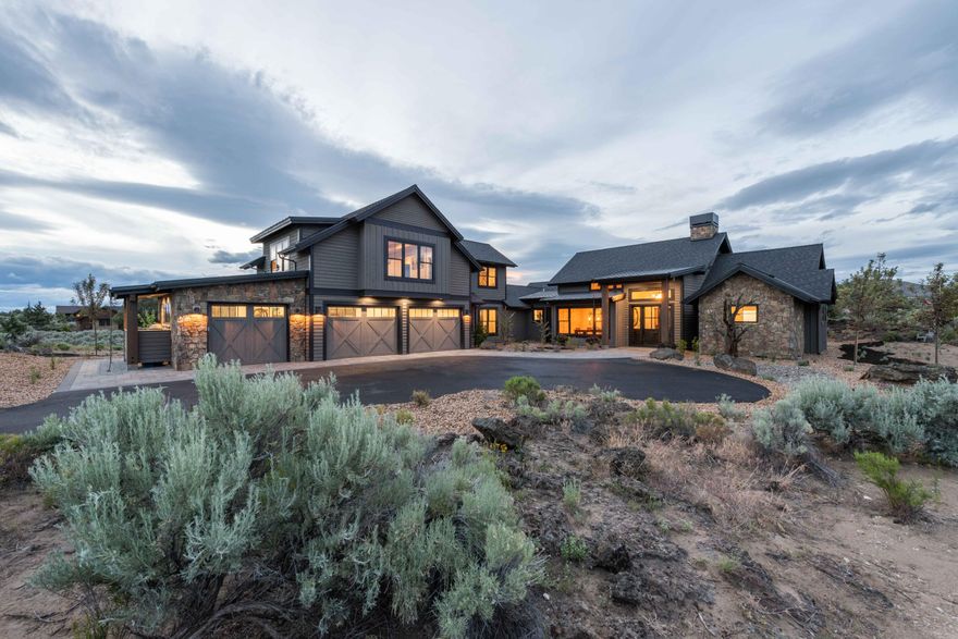 Brasada Ranch Custom Home - Stunning Hollyman Design - Beautiful entry with Custom Barn Doors opening to an Epic Great  Room, floor to ceiling Stone Fireplace. Natural  Light  flows into the Spacious Kitchen , Jenn Air and Wolf Appliances. One of a kind Reclaimed Axe Hewn Beam accented with three Pendants Lights Illuminating the Grand Island, Walk through Butler's Pantry, Splashes of Custom Barnwood Cabinets, Gorgeous Primary, Oversized Curbless Tile Shower, Heated Floors and Walk in Closet. Two Junior Suits on main. Airy Laundry Room with plenty of Natural Light, White Shiplap ,Floating Barnwood Shelves. Upstairs you have a Spacious Bonus Room for Entertaining, guest room and full bathroom. Off the Bonus Room Barn Doors open up into Office Space with Mountain Views.  Spacious 3 car Garage with Epoxy floors.  Inviting Outdoor Covered Living area and Custom Fire Pit with views of the Powell Buttes offer the perfect space to entertain friends or just kick back and relax.
