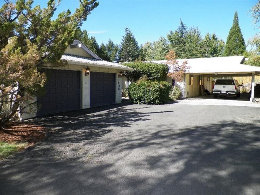 Beautiful 3 bedroom 3 bath home on a large lot of almost 1/2 acre in East Medford! Spacious kitchen that is open to the dining room and living room so it's perfect for entertaining. Large bedrooms and updated bathrooms. Separate laundry room with a counter and sink. New bamboo flooring throughout entry way and family room. Two separate decks, one has a hot tub Secluded fenced backyard that has fruit trees and an area for gardening. Covered carport and two car garage with a large driveway with plenty of room for parking. This is a must see!