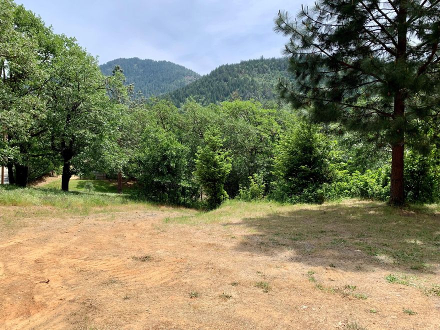 This quiet hideaway features a wooded 3.63 acre parcel located on a peaceful dead-end street only 2.5 miles from the edge of town. Bring your manufactured home or custom design your dream home to enjoy the mountain views. Level area is prepped for a potential homesite and the remaining acreage is beautifully treed and sloped. Power & phone at the street, driveway/pad roughed in, and a well, tested at 25 gpm when drilled. Newly approved septic site evaluation for a standard system, location of septic site approval is uphill from the homesite, opening up lots of room to enhance the driveway and pad. Owner will consider a short term contract with 35% down to a qualified Buyer. Don't miss your chance to build your dream!