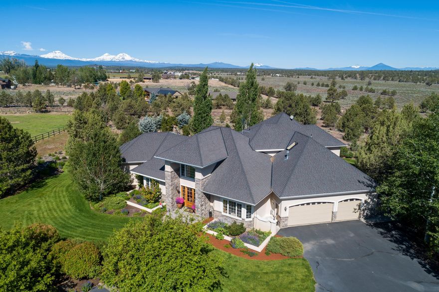 $500,000 price reduction! 9 Cascade Mountain peaks from 18 private acres in Tumalo. Horse lovers & mountain bikers will love the direct access to Maston trailhead. Surrounded by BLM land it's a quick walk across the street to the Deschutes River Canyon. Pamper your horses in the remodeled 5 stall barn w/pine ceilings, solid wood doors, run-in shelter, tack room, hot & cold wash stall. Light & bright custom home features the master bedroom, home office, spacious kitchen, great room & sitting room downstairs, 2 bedrooms, full bath + sitting loft upstairs. Enjoy the outdoors while indoors with views from every room. Very peaceful, serene, & private setting on the patios near the pond where you can watch an abundance of wildlife including Jack rabbits, horned owls, hawks, eagles, deer, red tailed & eagles. Fully fenced /cross fenced, 5 acres irrigated, 3-car garage, 5-bay RV garage shop + entertainment/exercise room w/bathroom adjacent to the barn complete this one of kind prop