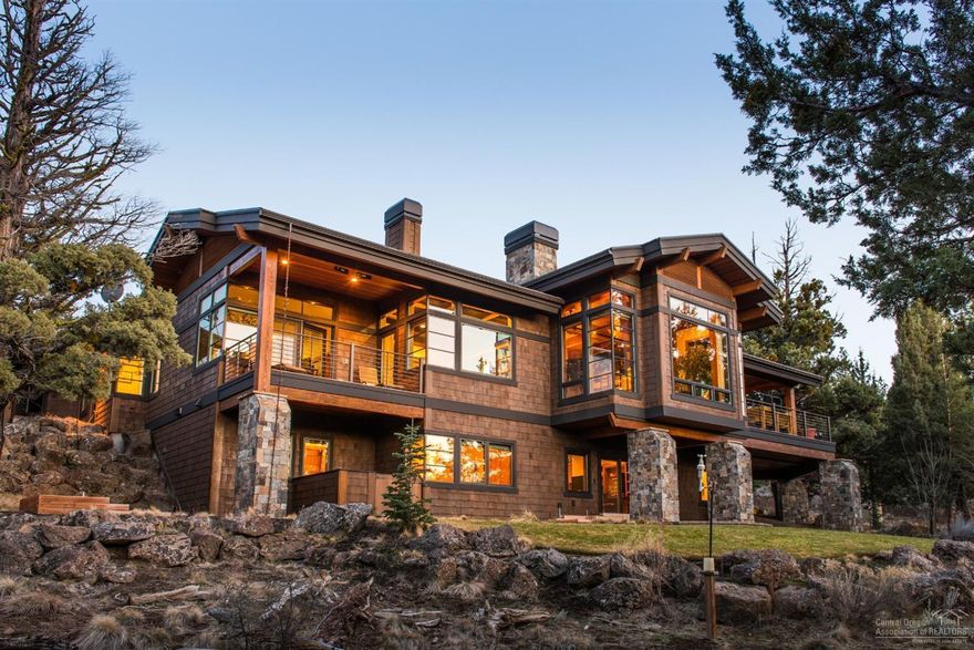 Exceptional custom home by Norman Bldg & Design offers the finest in craftsmanship and finishes. Floor to ceiling windows frame gorgeous Cascade views. Thoughtfully-designed plan includes main level master suite and home office, 2 add'l en suite bedrooms, bonus room & wine closet downstairs. Top of the line chef's kitchen features Blue Star ovens + 6-burner gas stove, wood-fired oven, Sub Zero & Miele appliances. Opens to a covered deck, perfect for al fresco dining. Private 1 acre setting close to trails.