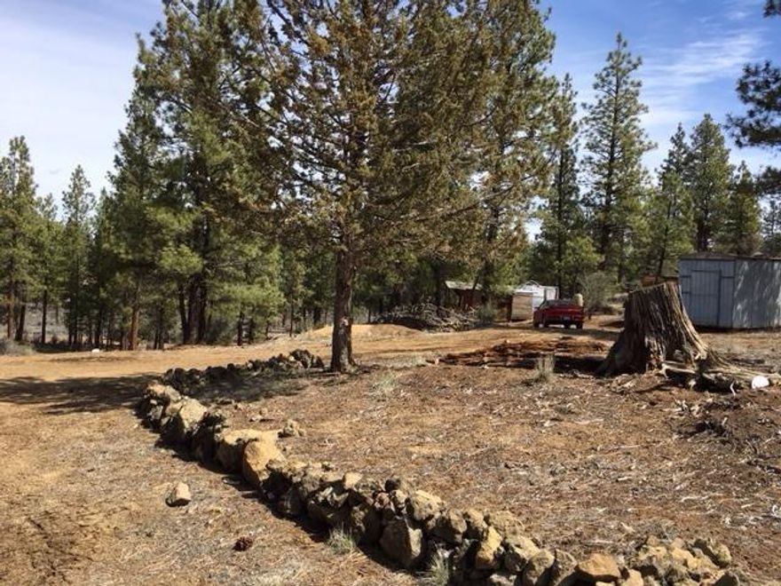 Nice, partially wooded lot with power at the street located on one of the better maintained roads in Klamath Forest Estates! This is a great opportunity to have the perfect spot for your dream home or vacation get-away! Close to National Forest and lots of Wildlife! Property has a small cabin the owners built ( no permits!), additional storage also.