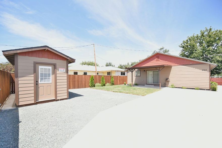 Like new adorable, well cared for 3 bed, 1 bath! Beautifully landscaped, next to the park! Room for a smaller RV, and even has a new storage shed! Completely fenced, gated entry, and security system in place, comes with property! Must see to appreciate, won't last long!! Newer refrigerator, dishwasher, garbage disposal, electric oven and microwave!