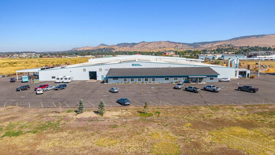 Rare heavy industrial opportunity in Klamath Falls just off the main corridor of Washburn Way! Located in the Oregon Enterprise Zone for potential tax incentives for new businesses. This 19-acre site is fully fenced and features a 108,500 sq.ft. facility, including a 6,000 sq.ft. office addition built in 2020 with lobby, conference room, ADA restrooms, private office, and large meeting space. The steel-framed warehouse/wood shop (approx. 102,500 sq.ft.) offers natural gas heat, A/C, fire sprinklers, metal roof/siding, negative air system for dust removal, pit docks, ramp, and former rail spur/pit area. Additional amenities include geothermal well, 14' overhead doors, break room with kitchen, daycare area, paved parking, elevated loading dock the length of the building, & wood shop space. Newer LED lighting throughout. Currently used for wood pallet manufacturing. Geothermal well. Priced below county assessed value—don't miss this versatile industrial property