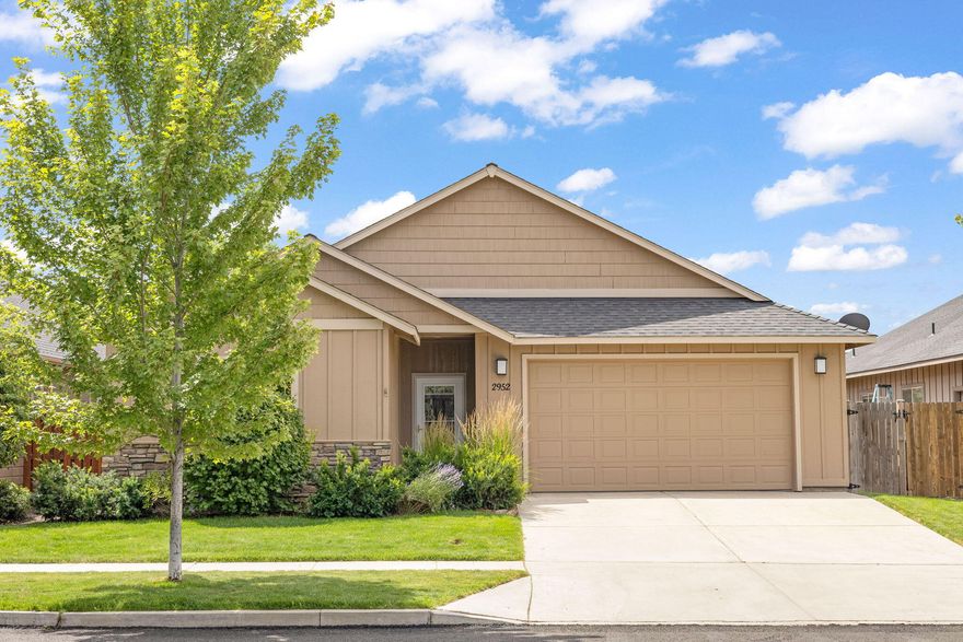 Located in Fieldstone Crossing, one of Redmond's most desirable neighborhoods, this well-maintained 3-bedroom, 2-bath home in Redmond offers 1,768 sq ft of comfortable living space. The open great room, featuring a gas fireplace & vaulted ceilings, seamlessly connects to the dining area and breakfast bar. The spacious kitchen includes quartz countertops, stainless steel appliances, and corner pantry. Additional features include laminate wood floors, custom window treatments, and a high-efficiency gas furnace with A/C. Enjoy low-maintenance xeriscape rear landscaping with a drip system for mature cherry & apple trees, and fully fenced yard. The covered rear patio includes a hot tub and is wired for 240. The double-car garage offers ample storage, and a shed provides extra space for outdoor equipment. This home is lightly lived-in, with a meticulous owner, and is ready for immediate move-in.