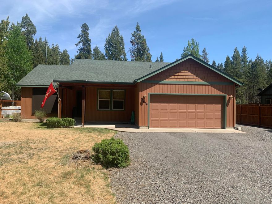 Beautifully maintained single-level home with detached 30x36 shop on .53 acres. Are you looking for a home that is move in ready? This is the one! Exterior paint in 2017, freshly painted interior and newly installed luxury vinyl flooring. Living Room with vaulted ceilings and gas fireplace. Kitchen has eating bar, stainless appliances, and gas range. Master Bedroom features walk in shower and soaking tub. Enjoy the privacy of this fenced back yard with deck and patio. The Gardner in the family will love the green house and raised beds! Shop has 220 and wood fireplace that heats it up wonderfully for working in the cool winter months. Located on a paved street with city water and sewer. River Access just a short walk away!