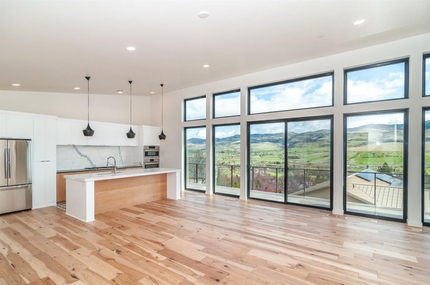 Fabulous new construction by Magnolia Fine Homes, Earth Advantage Certified. The Valley View'' is a beautiful modern home with a flair for the contemporary, yet still warm and inviting. You'll find this home's appearance striking, with horizontal lines, low maintenance stucco, and a wonderful contrast to the smoother siding materials. The clean rectangular lines of the windows work with the angled, multi-level roof lines to create visual interest. On the main level you'll find an open floor plan, beautiful fireplace, built in shelving providing the perfect space to remain warm and cosy while you watch the night sky. All bedrooms have private bathrooms, creating suites throughout the home. In the kitchen fixtures are placed within easy reach, and cabinets are well organized for stacking up pots and pans.The master suite is on a private wing capturing moving light, giving you a quiet space. Between the beautiful vaulted ceiling and large windows, you'll enjoy a sense of spaciousness.