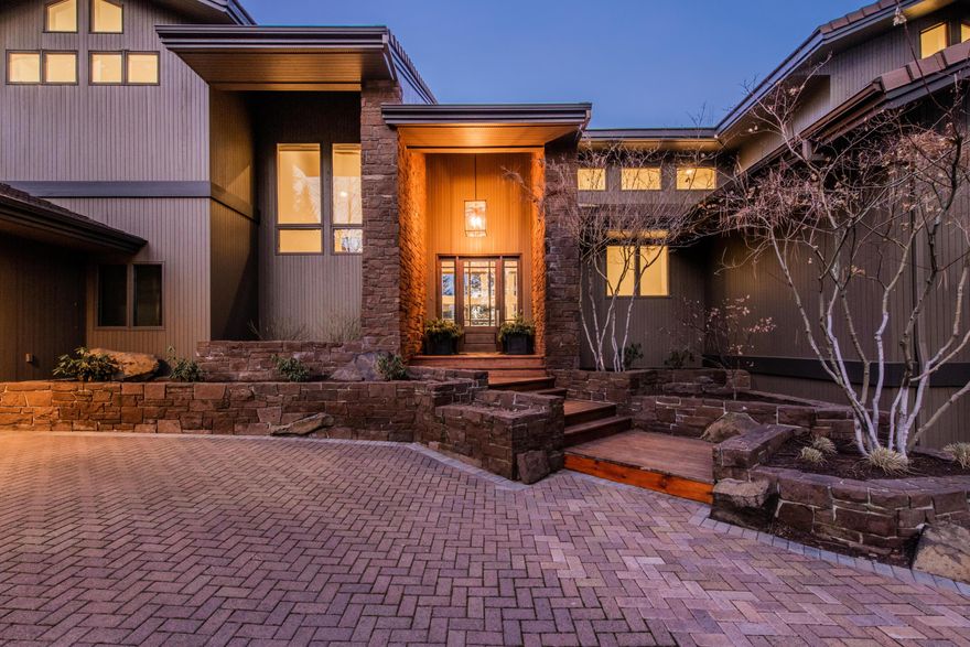 Gracefully updated and upgraded in nearly every way, this Broken Top retreat is a breath of fresh air. Tucked away on a cul de sac beneath towering pines, this home's unassuming grandeur is realized upon entering into its Architectural Digest-like layout and design. Towering ceilings, grand rock fireplace, and floor-to-ceiling windows stun, while beautiful hard finishes seamlessly connect each space with a mountain-modern style. Intentionally designed around welcoming and gathering, each space fulfills a purpose, blending equal parts comfort, luxury, and functionality - including plenty of cozy nooks for reading and playing. Within walking distance of the driving range, Clubhouse and golf course amenities of Broken Top Golf Course and surrounded by a peaceful and quiet community in close proximity to schools, thriving restaurants, shopping, and outdoor activities. This a must-see opportunity in a sought-after neighborhood where livability and style have been perfected.