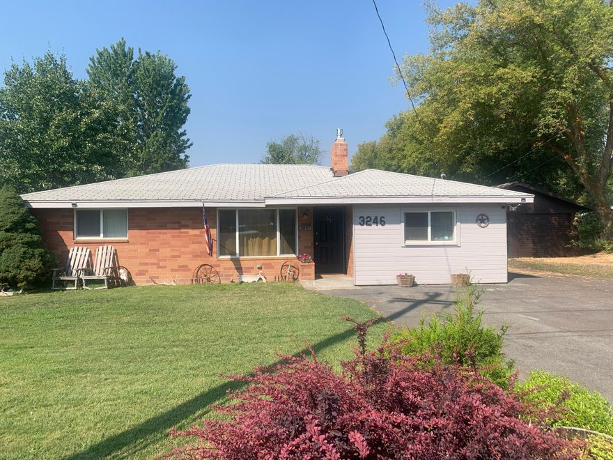 Large, updated 4 bedroom, 2 bath house on over 1/3 acre lot – with a SHOP! Gorgeous flooring, light/bright kitchen with breakfast bar and a fantastic floorplan that features two living spaces, an enclosed porch, and a covered patio overlooking the large fenced backyard. There is also a separate dog run, fruit trees and extra storage sheds. The shop Is 24 X 36 with 220 power, 2 roll-up doors – including a pass-through door for easy access to store your toys in the backyard.