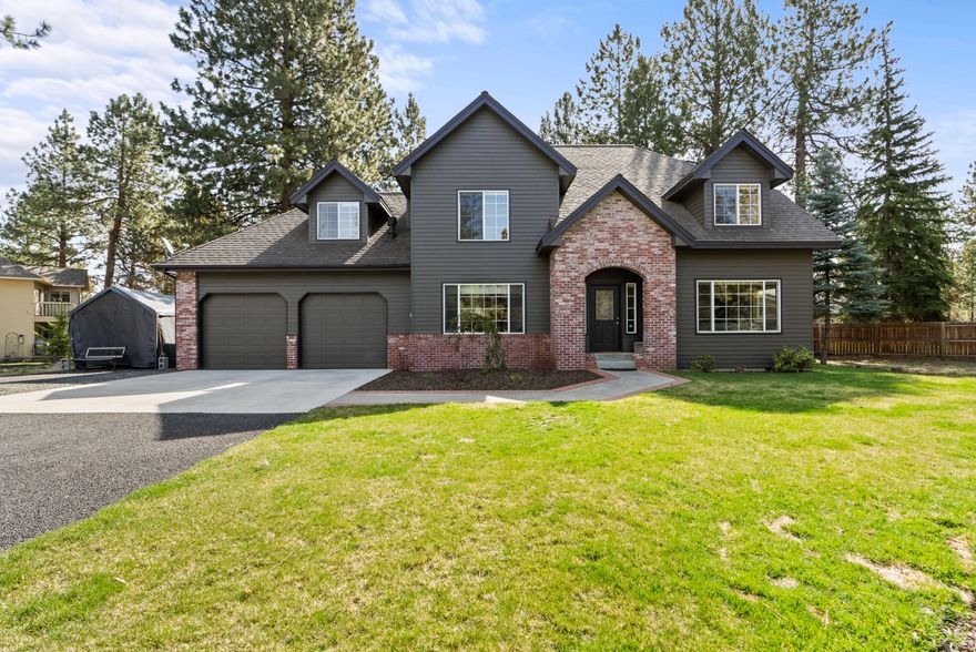Spacious & Private 1.42-Acre property in the heart of SE Bend. Experience the best of both worlds--space & privacy with a central location--from this beautifully maintained 1.42-acre property in desirable SE Bend. Just steps from canal trail access w/ stunning Cascade Mtn views, & moments from Alpenglow Park & Caldera High, this home offers a rare blend of convenience & a peaceful, county-like setting. This traditional 4-bed, 2.5-bath home features all bedrooms upstairs, with multiple living & dining areas. The home has been lovingly maintained, with recent upgrades incl. new exterior paint, kitchen appliances, flooring, fireplace, window coverings, roof, furnace, & storage shed. Enjoy the outdoors from the spacious back decks, ideal for entertaining, & take advantage of the fully landscaped yard w/ room for RV parking, plus space to add a shop or ADU. The property is dividable, offering excellent potential as both a comfortable residence and a smart investment—now & into the future.