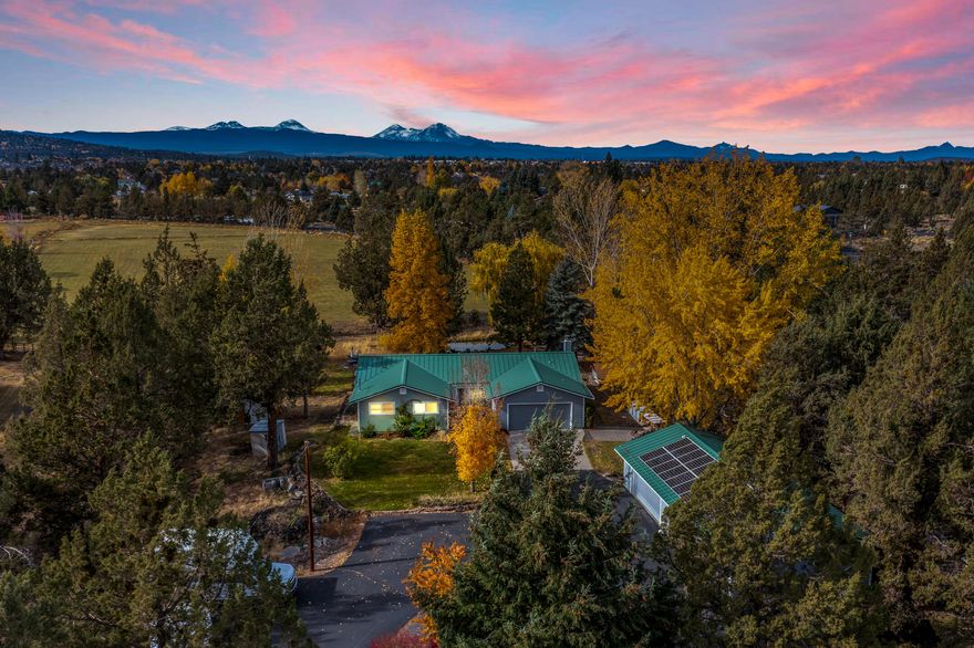 Beautifully remodeled small acreage ranchette just outside of Bend city limits. 3 bedroom 2 bath easy single level living nicely finished. Concrete counters, maple hardwood and solar panels for low power costs. Awesome newly finished out building can serve as a multitude of things, yoga studio, art studio, office or root cellar. Less than a half mile to Ponderosa Elementary school and Pine Nursery Park/dog park. 10 minutes from downtown Bend, only minutes from NE shopping, dining and the Bend Airport. Easy access to St. Charles Medical Center. Five minutes to Mt. View High School and Skyview Middle School. 45 minutes to all the Cascade Lakes have to offer, only 40 minutes to Mt. Bachelor. 20 minutes to Redmond Commercial Airport. Great privacy on this small acreage in an urban setting. Mountain views with your own pond, half an acre of irrigation rights, with two double garages and two carports. Gardens, fields, birds & wildlife on your own private reserve. Check out the video!