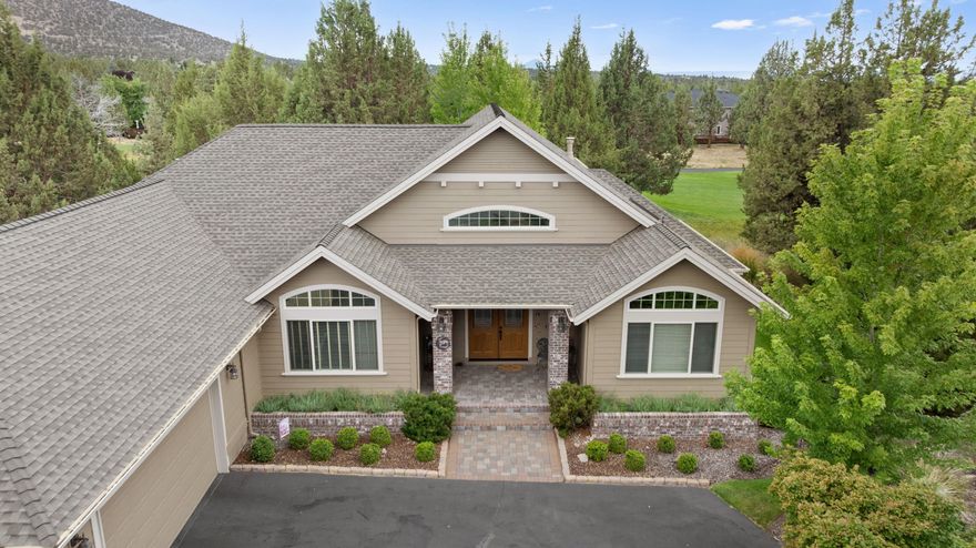 Discover the ultimate Central Oregon lifestyle at 909 Willet Ln. This custom home blends comfort, elegance, and indoor-outdoor living, perfect for both relaxation and entertaining. A vaulted, light-filled great room with gas fireplace, reclaimed wood beam flooring, and built-in bookshelves invites you to unwind or gather with friends. Work from home in the office/den with custom built-ins, then retreat to the private primary suite with double-sided fireplace, spa bathtub with jets, and French doors to a serene patio.
The kitchen has granite tile counters and matching inlaid flooring, ideal for hosting or quiet mornings. Outside, the 2 patios,  and a tranquil water feature create an oasis for dining and sunset cocktails. Overlooking the 2nd tee box, you'll enjoy golf course views, a vibrant community atmosphere, and an oversized 1,107 sq. ft. garage for vehicles and hobbies. Whether a vacation escape, STR, or forever home, this property has it all.
