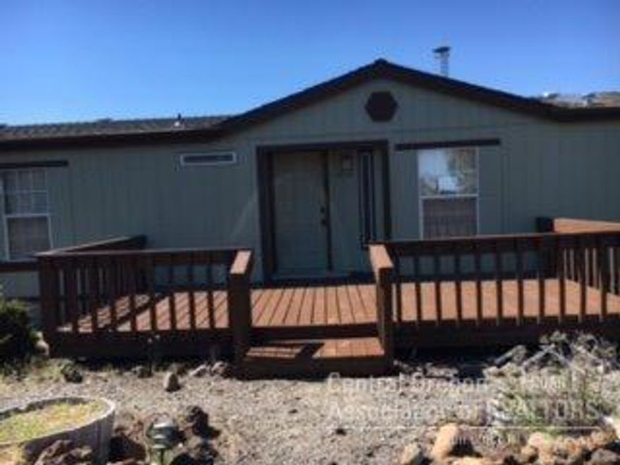 You will be impressed with the new paint inside and outside, new carpeting, clean and ready to move into. Spacious back deck, huge shop building plus a storage building with roll up door. Location offers room to move on a 1.38 acre lot in Crooked River Ranch.