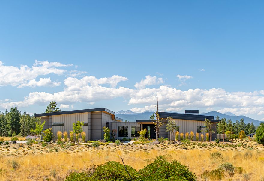 Located on a corner lot in the desirable Tree Farm neighborhood, this CS Construction built home offers wonderful single level living. With an open concept kitchen and formal living room as well as large windows allowing a peaceful amount of natural light in the home. The Kitchen boasts 2 dishwashers, large kitchen island with seating & a butlers pantry. There are 3 en-suite bedrooms, + bonus room allowing for multiple living areas. The home has solar paneling, radiant flooring as well as ductless forced air/ac, gas fireplaces indoor & out, remote controlled window treatments & so much more. On the exterior you have two patio spaces to enjoy the Cascade Mountain views! The oversized garage with epoxy flooring, storage, workbench, along with high ceilings & one tall garage door offers an abundance of storage for your Central Oregon lifestyle. Call today for a private tour!