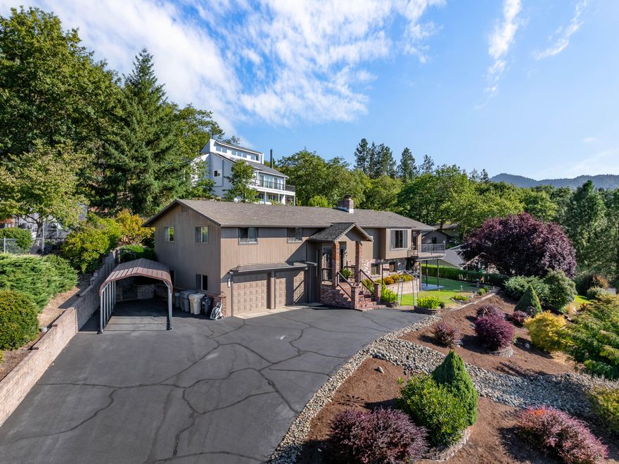 Expansive valley views highlight this thoughtfully updated home. The exterior was repainted in 2023, and the interior includes new flooring and granite countertops in both the kitchen and bathrooms. The kitchen offers a functional layout with reliable appliances, refrigerator, and a double oven installed in 2022. Recent system updates include a new water heater, air conditioner. Open living areas provide versatile space, complemented by a large bonus room and an oversized garage with room for vehicles, storage, or projects. Combining practical updates with a scenic setting, this home offers comfort and flexibility throughout.