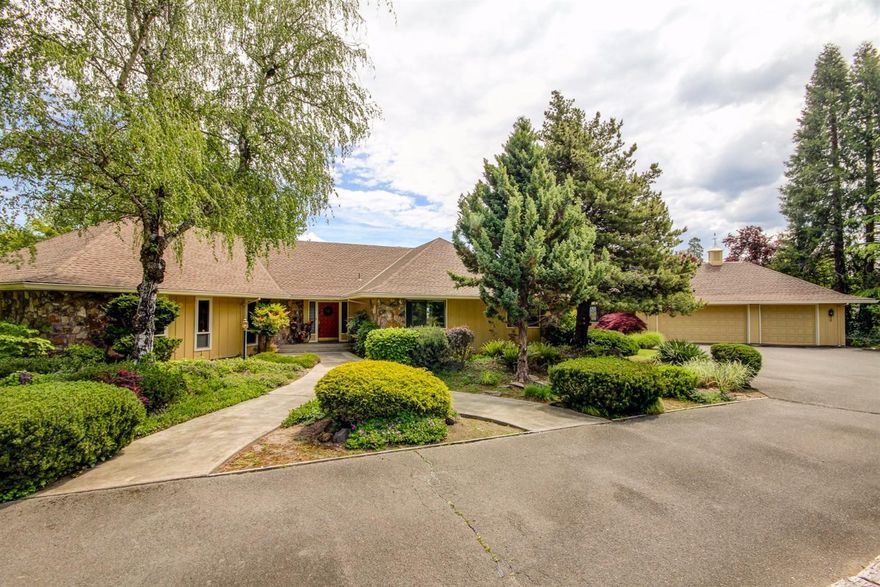 Incredible country estate is just 2 miles from J'Ville. Unbelievable landscaping in this park like setting. As you cast your eyes over this impeccable 3 irrigated acres, you will see your own year round pound with lily pads, and a manicured lawn that is second to none. Then imagine the panorama view as you cast your eyes from Grizzly Peak to the south, overlooking the Rogue Valley and Mt. Mcloughlin with a big hello to the north. You can find this view from your kitchen, formal dining, living room and Master bedroom. And no stairs with this single level split floor plan. A 3080 sq ft 3 bed 4 bath home has a huge master suite with large his & her walk-in closets. The open style kitchen with a vaulted ceiling, skylight, and large island working station will offer the chef many hours of joy and entertaining. Oh and did I mention the view! Step outside to over 1300 sq ft of deck overlooking the in ground gunite heated pool with electric pool cover. And finally a 3 car garage with workshop