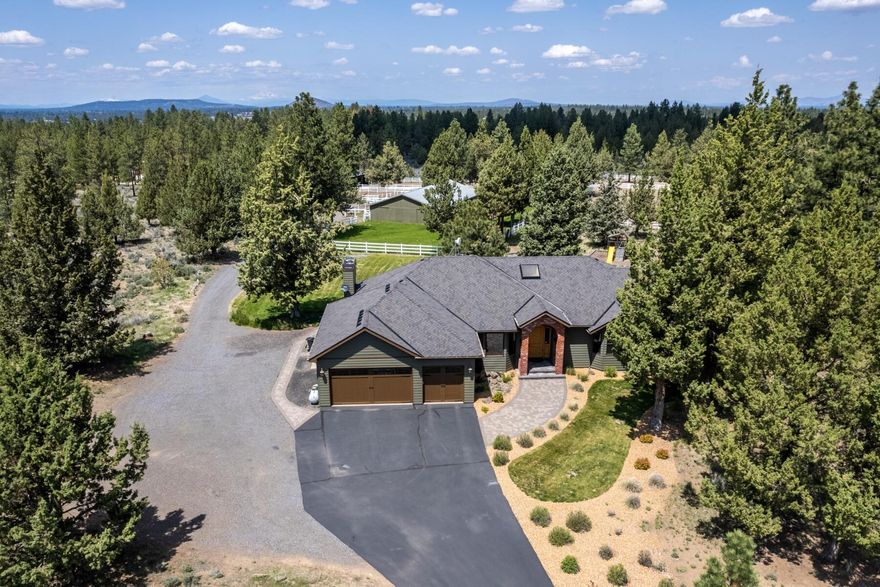 Private oasis nestled on 19.54 acres in the gated community of Horse Butte where you can enjoy riding horses, bikes, ATVs, and dirt-bikes in the Deschutes National Forest directly from your property. This gorgeous well-maintained, updated single level rancher features an open concept kitchen, large laundry/mudroom, 3-car garage, office with ample built-ins, and 2nd living room perfect for entertaining. The primary has direct access to the backyard, large bathroom with a tiled shower and a large walk-in closet. Down the hall, you will find 3 additional bdrms, 1 with a gorgeous en-suite. The property has an amazing 9-stall barn (with foaling stall), tack room, wash rack area with hot water, automatic waterers, dog run, 4 fenced paddocks, loafing shed, and a 95X190 outdoor arena. There is also a fenced garden area, greenhouse, fire pit, and paver patio. Such an amazing opportunity to own your slice of paradise. The home and barn have been recently painted and roof was replaced in 2021.