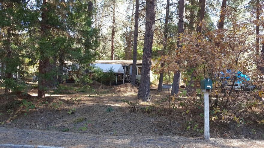 Manufacture home on 1.23 acres, that is in need of repairs. Property sold AS IS. Wonderful lot. Buyer to do own due diligence.