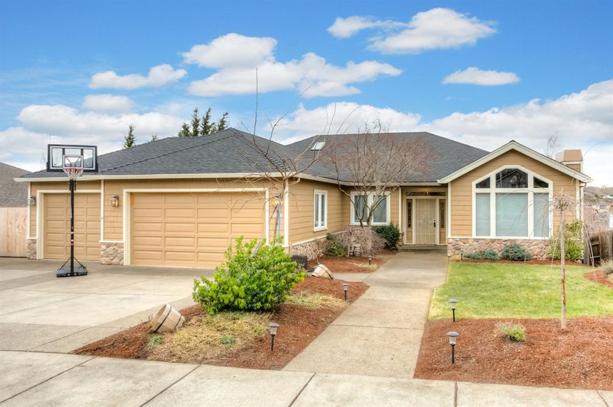 This gorgeous, single level home has been beautifully remodeled. The open kitchen features tiled backsplash, gorgeous granite countertops and a huge eat-in island. There are lots of windows and great natural light. Incredibly versatile floorplan features a vaulted living room with beamed ceiling and gas fireplace, formal and informal dining and a roomy family room with built-in entertainment center. Hardwood floors and new carpet. Two of the three bathrooms have been completely remodeled. Sun-filled master suite has views, direct access to the private and covered patio. Master bath features tiled vanities, corner tub and private shower. The basement level has exterior access from the yard and features a huge recreation room ideal for a home office, kids hangout, home gym and more. Three car attached garage PLUS RV parking. What more could you want?