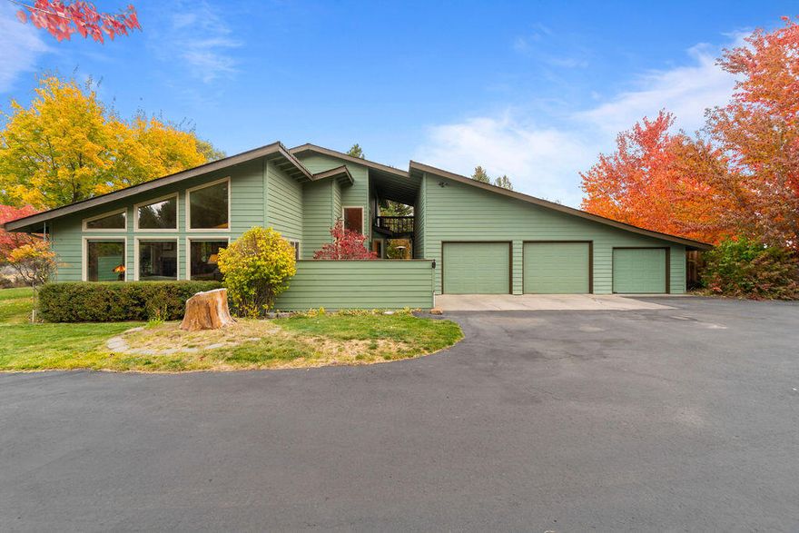 Come see this peaceful retreat in the small highly desired neighborhood of Quail Ridge. The open and window lit living room invites you into this incredibly renovated home. This home would be great for both a quiet lifestyle or hosting endless gatherings. With newer Kitchen Aid appliances, including two ovens, the cooking world is open to you! There are three bedrooms on the lower level and a secluded primary bedroom suite upstairs. Two separate garages have room for cars, storage and then some more. Don't miss the garden that boasts irrigated garden boxes, fruit trees and much more.  The property feels peaceful and quiet but has all the accessibility of being close to town. 
Take time to see all of the facets of this GEM of a property!